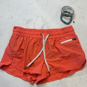 Vuori Orange Athletic Shorts